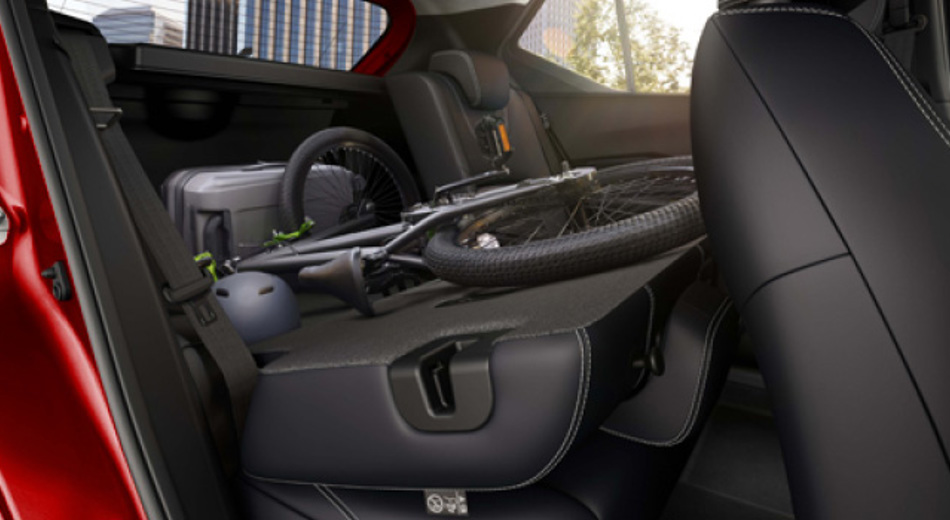 Nissan Kicks flatend seats, side view with bike inside
